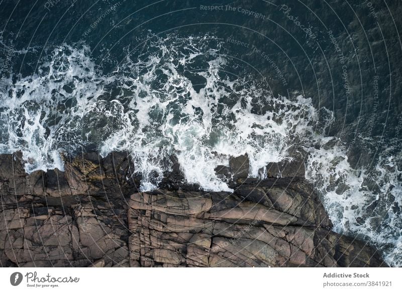 Scenery of rocky coast and waving sea seascape wave spectacular stormy rough shoreline seashore nature water stone foam marine idyllic beach breathtaking