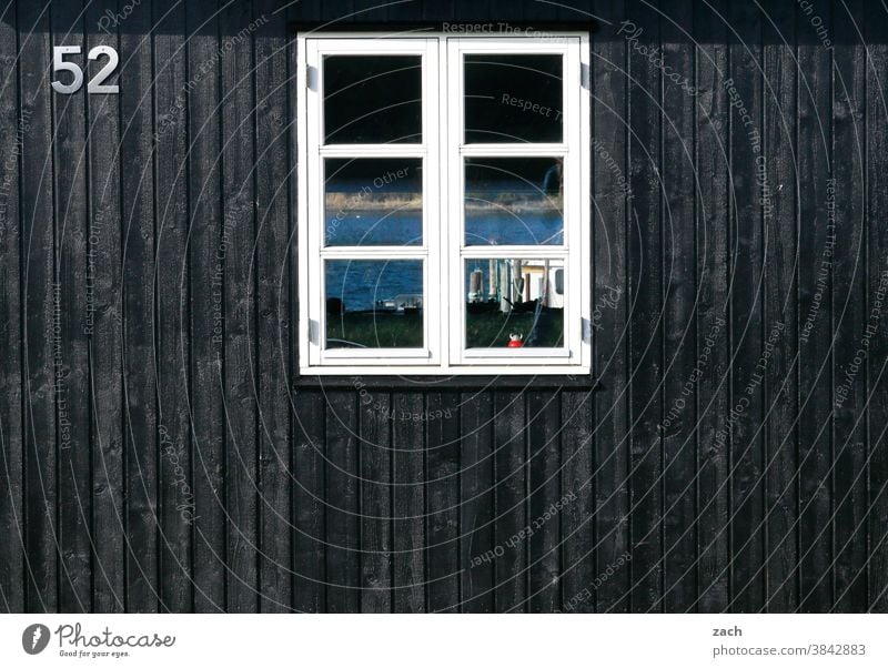 52 with view House (Residential Structure) Hut Wooden house Wooden hut Fishermans hut Black fifty-two board Window pane Reflection Facade Digits and numbers