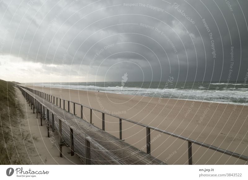 Wooden jetty on the beach of Westerland before approaching storm wooden walkway Beach Ocean North Sea Sylt Empty Gale Weather Bad weather Rain