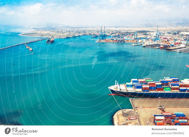 Callao, Lima / Peru - November 4 2020: View of dock and containers in the port of Callao drone view aerial photography aerial view freighters carrying unloading