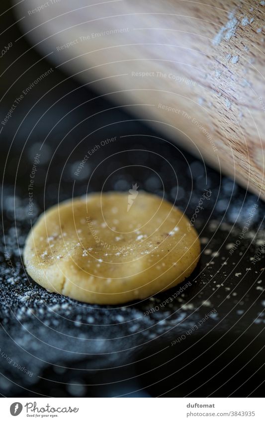 Dough with rolling pin on floured work surface in the kitchen Cookie dough Rolling pin Baked goods Food Colour photo Nutrition Baking Close-up cute Delicious