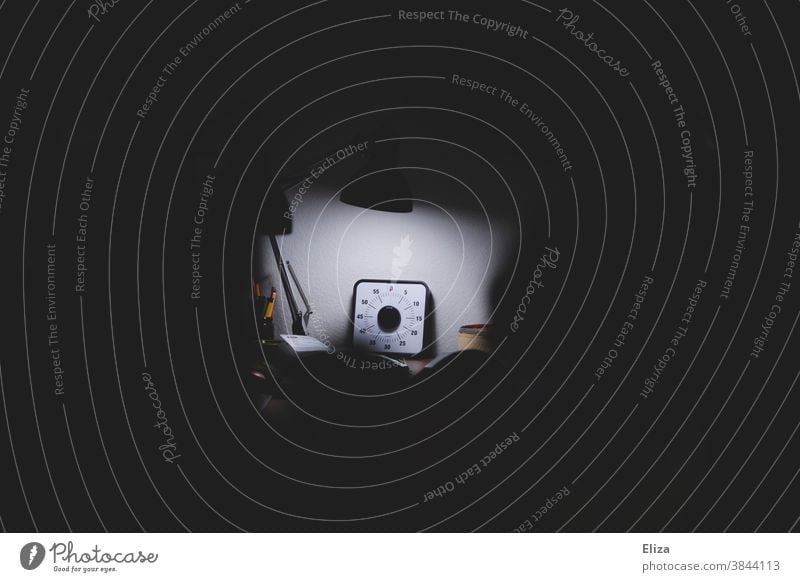 Workstation with stopwatch Clock Stopwatch Time shortage Stress Dark Prompt Clock face deadline Lamp Office somber Workplace labour