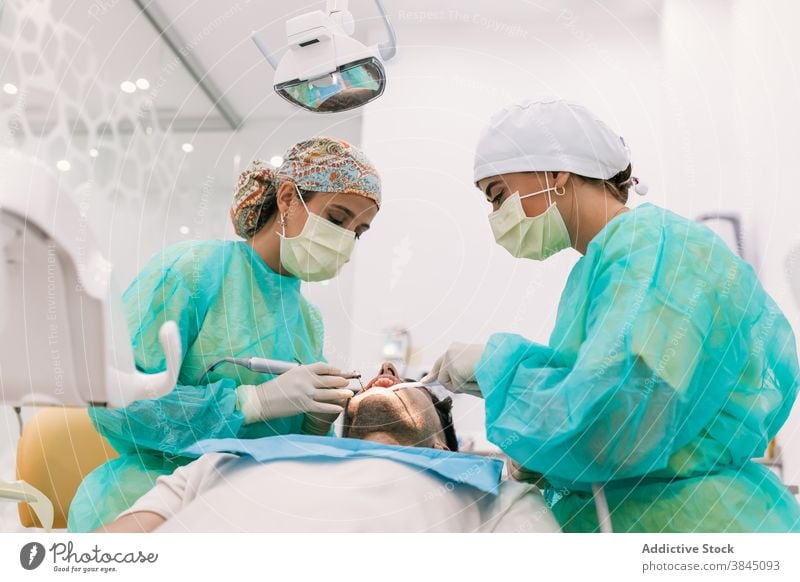 Dentist testing a splint in the clinic on his patient tooth dentist implant denture medicine crown dental dentistry doctor oral medical treatment hospital