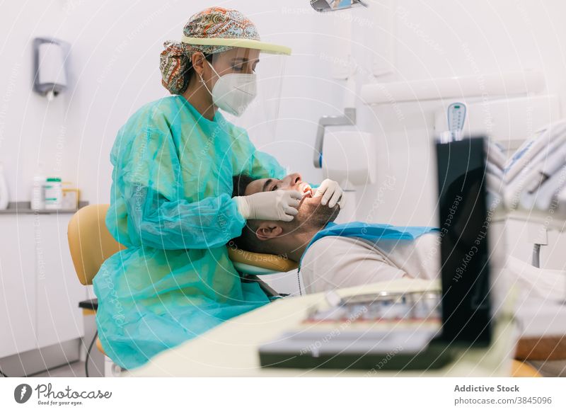 Dentist testing a splint in the clinic on his patient tooth dentist implant denture medicine crown coronavirus covid-19 dental dentistry doctor oral medical