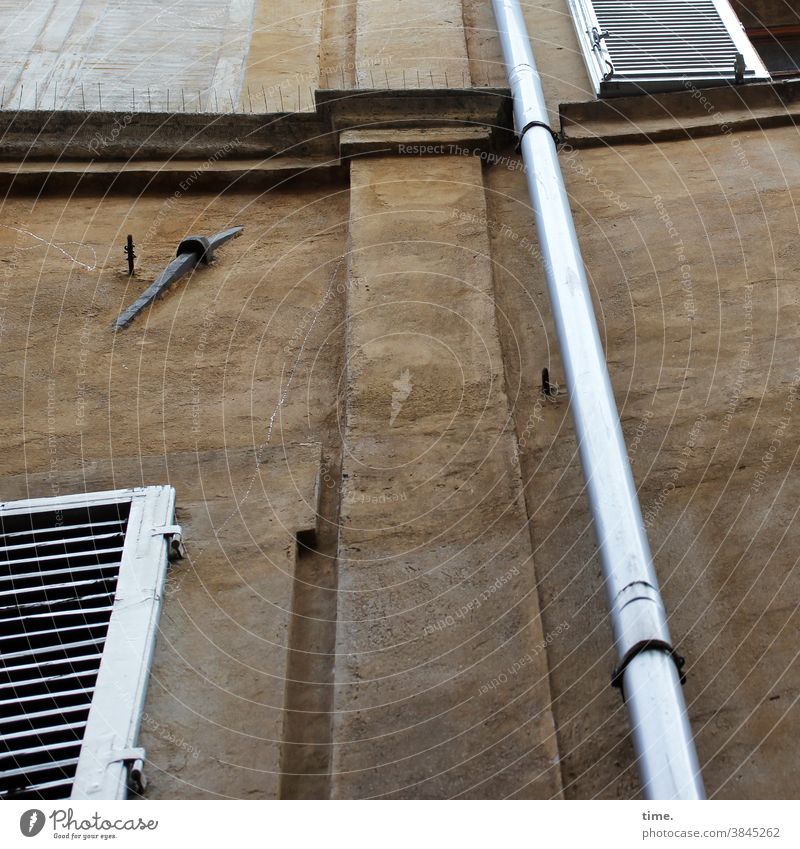 Neighborhoods | two shops, one anchor, what against pigeons and ne liquid slide hais house wall Wall (building) Facade Downspout projection on a wall Shutter