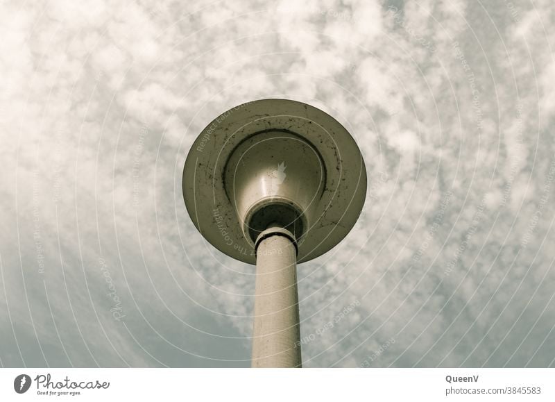 Street lamp with sky and clouds street lamp Light streetlamp Sky Clouds Gray Derelict Decadence Street lighting Loneliness dirt Environmental pollution Town