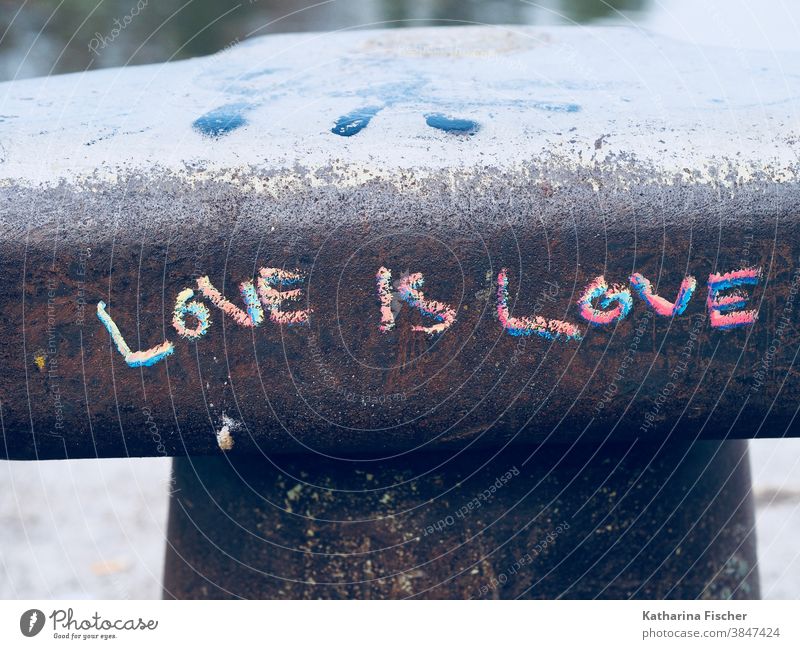 LOVE is LOVE Graffiti Love Emotions Exterior shot Wall (barrier) Wall (building) Colour photo Sign scripture Writing font Chalk drawing Red Blue Gray Day