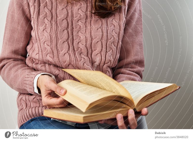 Woman sitting and reading a book. Relaxing concept page relax education turn open row document knowledge science stack old person people adult lifestyle