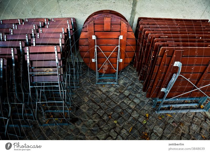 Beer garden at rest Bench corona Gastronomy Closed Folding chair Folding table Crisis broke Holiday season End of the season closure Chair Table too off-season