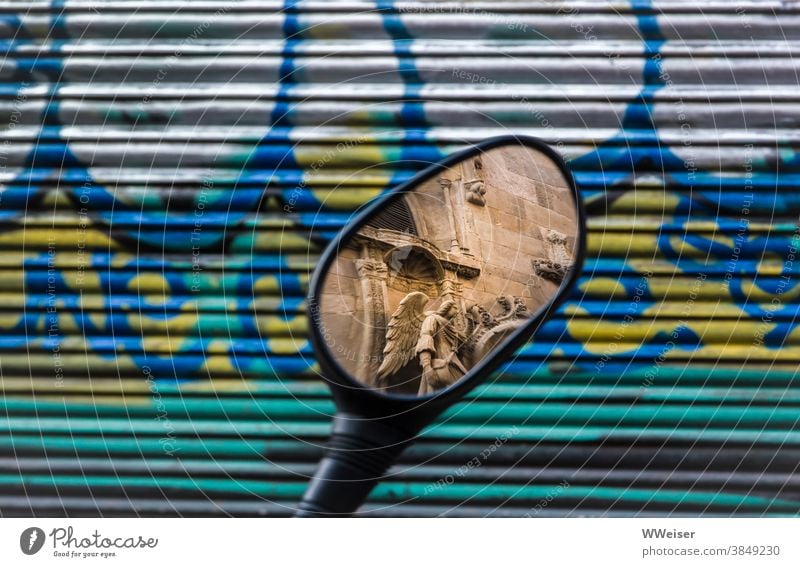 In the rear view mirror of the motorcycle you can see a piece of the old church with the angel Rear view mirror Mirror Graffiti Angel Church Facade Motorcycle