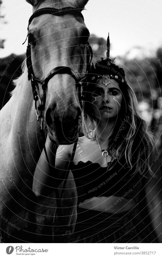 Young beautiful girl with white horse in forest. Woman horseback rider in boho style. Summertime nature scene. animal attractive beauty caucasian countryside