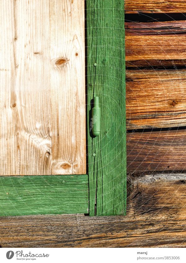 Lockdown, even on the mountain pasture. Nailed window at a mountain hut with green window frame Window Window frame Green idyllically Rustic Nailed down