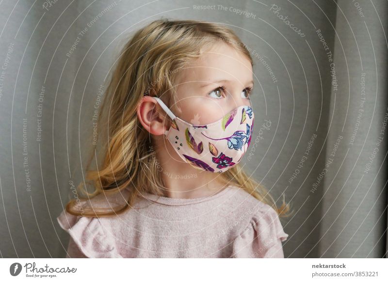 Caucasian Girl Wearing Protective Face Mask Looking Away child girl portrait mask protective face mask blond caucasian lifestyle side view female looking away