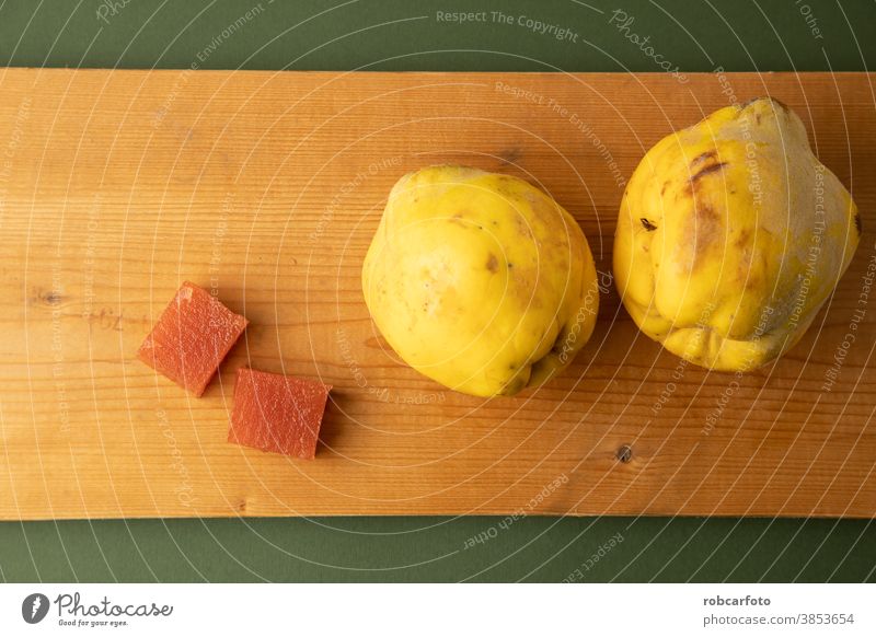 quince fruit on green background sweet fresh wooden food organic ripe autumn season vegetarian tasty closeup natural raw group copy space plate healthy table