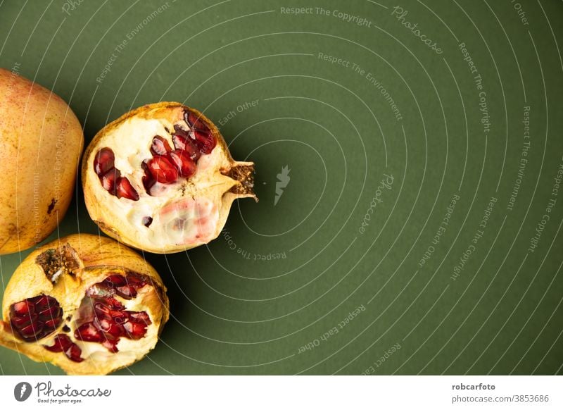 pomegranate fruit on green background sweet juicy wooden healthy food raw nature natural ingredient table organic ripe vegetarian freshness seed dessert drink