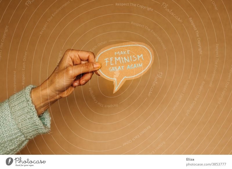 hand holds a speech bubble that says "Make feminism great again". Feminism, emancipation, equality. Emancipation equal rights Speech bubble Equality Society