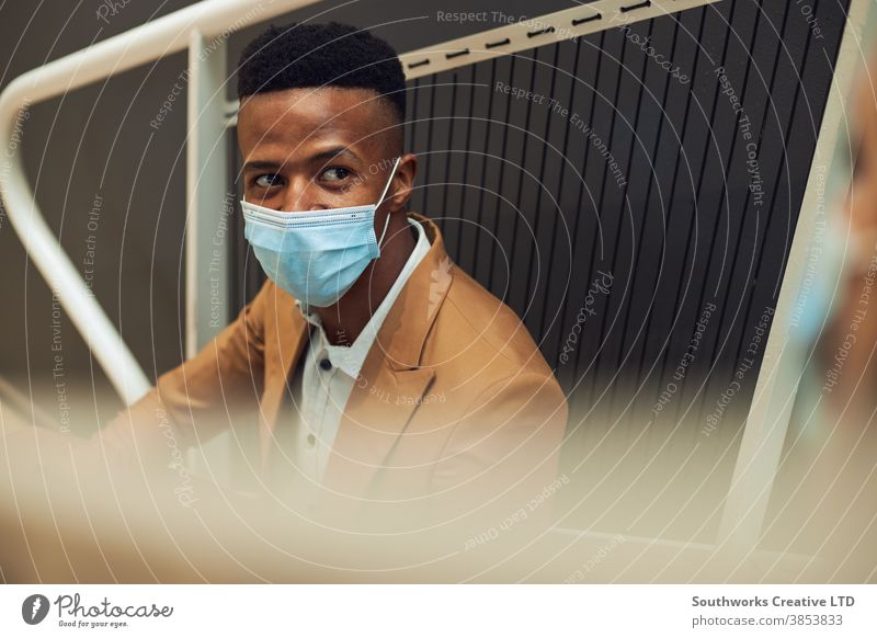 Business Couple Wearing Masks Meet On Office Stairs During Break In Office During Pandemic business businessman businesswoman face mask face covering wearing