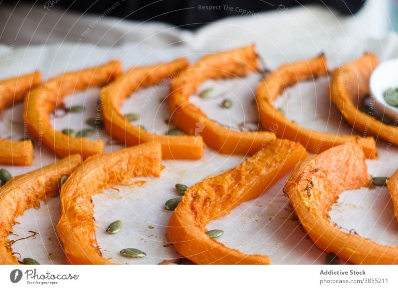 Crop cook preparing pumpkin in kitchen slice smash puree prepare food baked soft vegetable healthy wooden board cutting board chopping board organic fresh