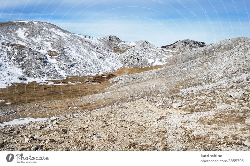 The top of Cervati mountain in Cilento National Park Trail italy Campania diano snow landscape blue stone nature rock sky outdoor trekking hiking path sport