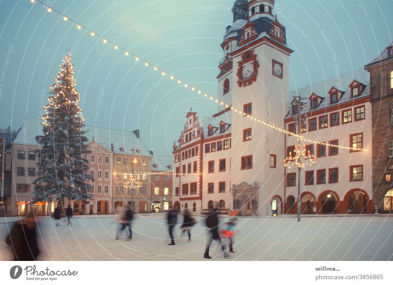 Winter on the Christmas-decorated market square, historic town hall Marketplace Christmassy old market Historic winter Christmas tree people Light chains