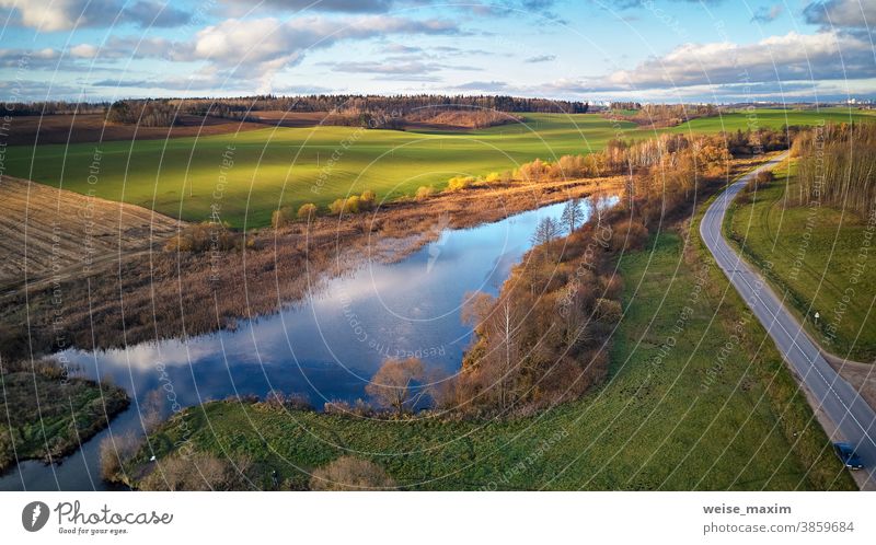 Beautiful green field. Winter crops. Lake with blue sky reflection agriculture nature winter outdoor land grass plant fall November background landscape rural