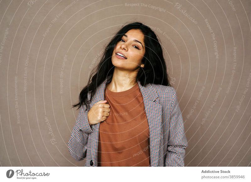 Cheerful woman in stylish wear in studio style jacket trendy laugh cheerful having fun model charming female ethnic happy young pleasure relax optimist modern