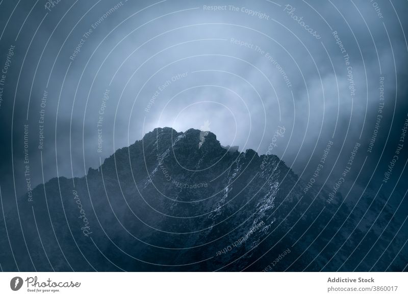 Rocky mountain ridge covered with snow rock range rough slope peak cloud panorama cold majestic scenery rocky nature landscape altitude environment picturesque