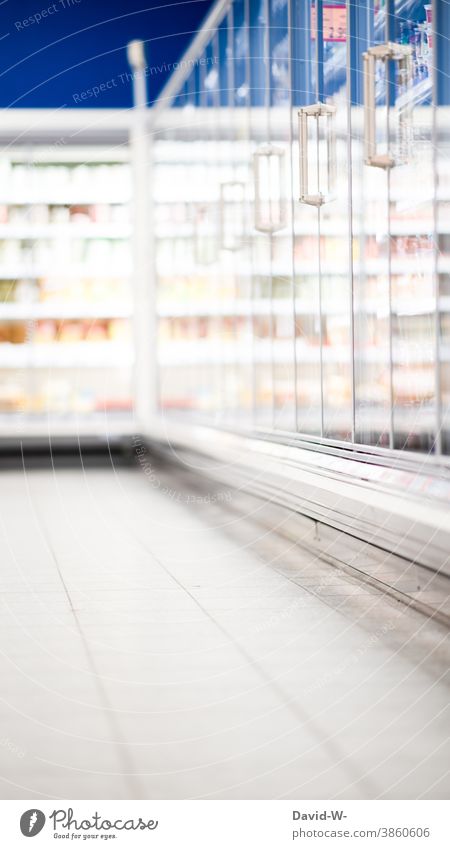 aisle with goods in a supermarket Supermarket Load Corridor Shelves cooling compartment food products Retail sector Markets Shopping Hypermarket