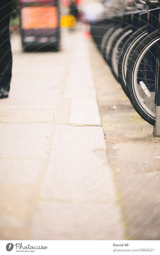 Bikes in a row at the roadside Wheels bicycles Row turned off rental Town Arrangement Roadside Cycling Bicycle rack Street Parking Means of transport