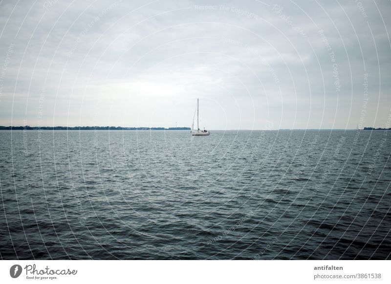 Out to sea Stralsund Baltic Sea Strelasund Mecklenburg-Western Pomerania pre-Pomerania Waves Water Sailboat Sailing Skyline Horizon Wind Clouds Covered centered