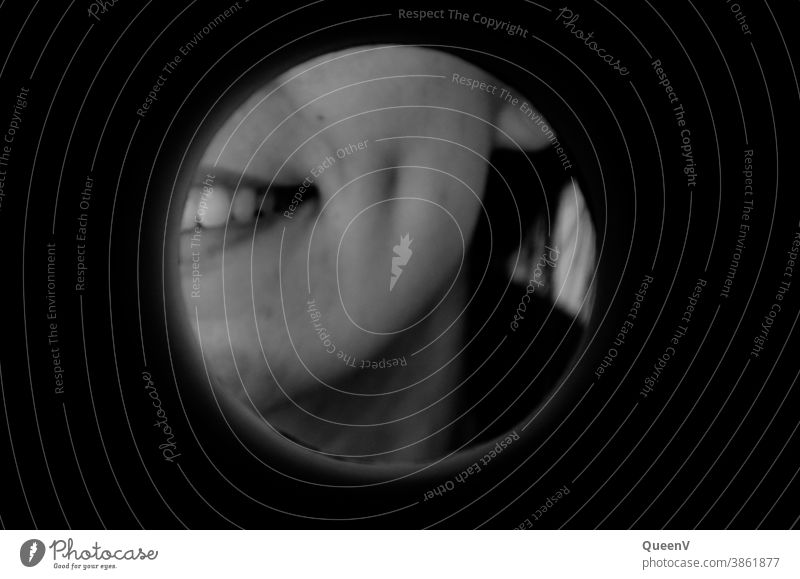 Smile of a girl with dimple in black and white, seen through a round hole smile woman dimples on the cheek circle 18-25 years Young woman Adults 18 - 30 years