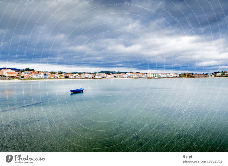 Nice fishing village sailor ship boat travel ocean vessel harbor port coast cloudy landscape spain spanish urban city sea shore town maritime atlantic mooring