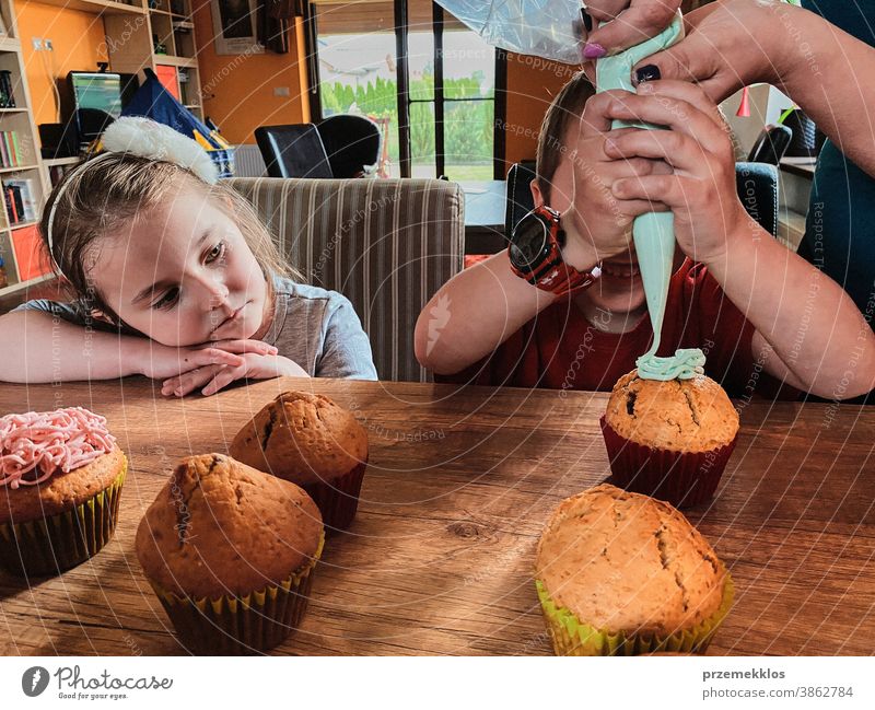 Children baking cupcakes, preparing ingredients, decorating cookies children cooking bake family domestic muffin together childhood happy little kid kitchen