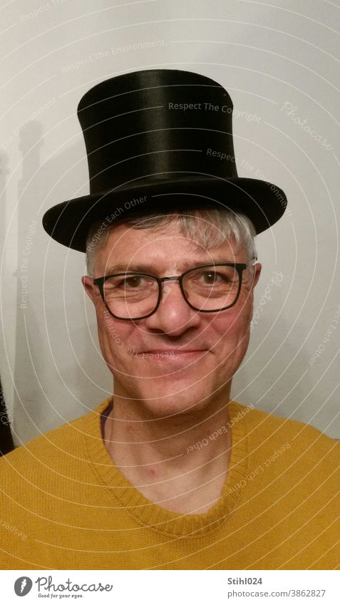 Chapeau! - Man in his fifties with a black top hat Cylinder Hat Black chapeau Sweater Yellow mustard yellow Eyeglasses Laughter fun Circus Theatre Classic