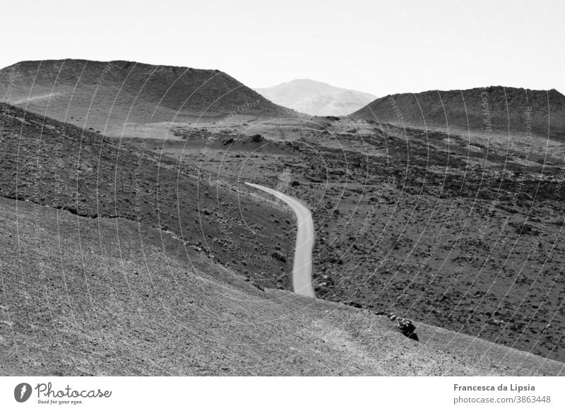 Volcanic landscape on Lanzarote Volcano Landscape Black & white photo Exterior shot Vacation & Travel Deserted Island Mountain Nature Far-off places