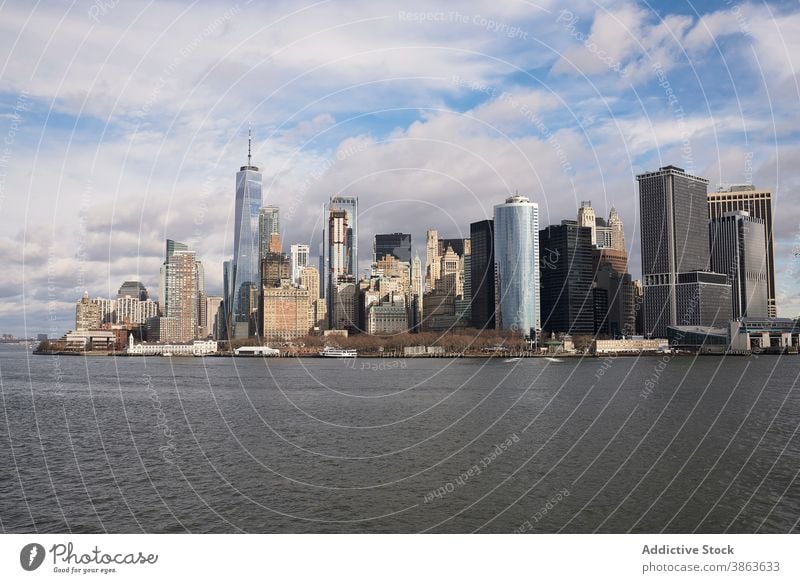 Modern megapolis on river bank on sunny day manhattan cityscape skyscraper skyline shore building multistory megalopolis new york america united states usa