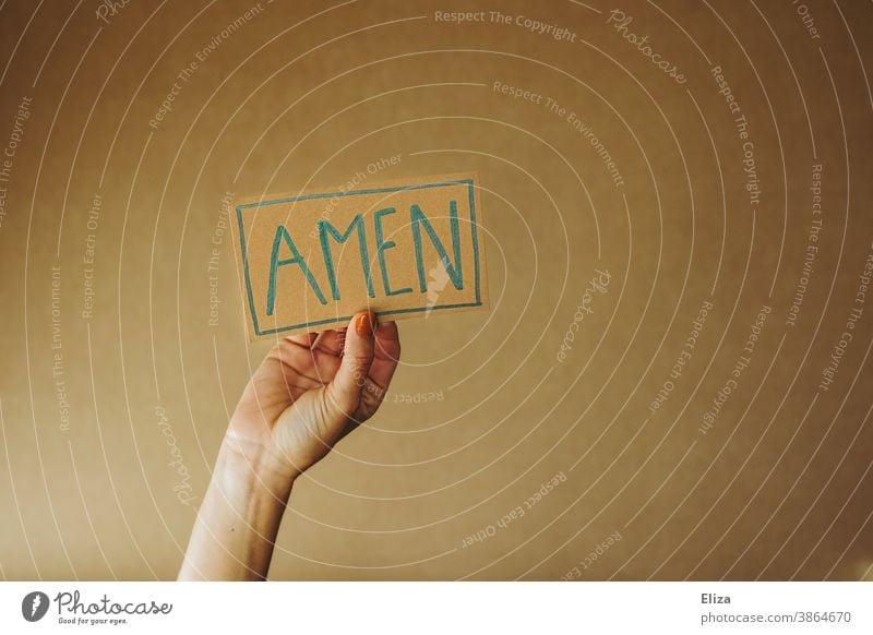 Person holds a sign with the inscription Amen amen Church Heart Prayer pray Religion and faith religion Christianity Judaism praying Love Belief believe Holy