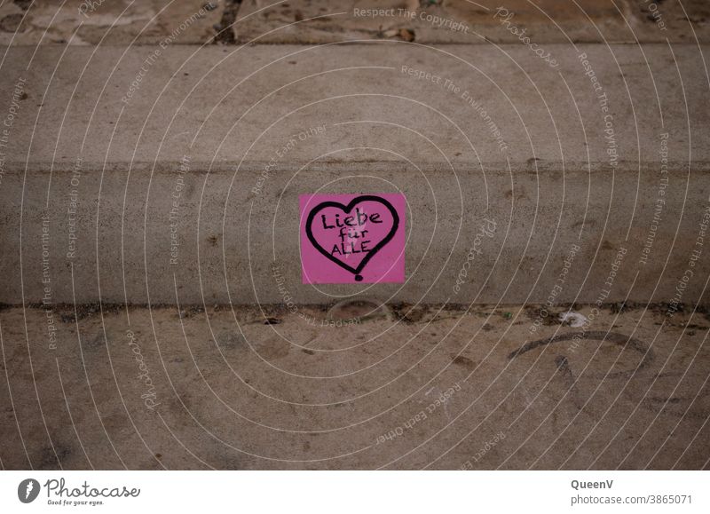 Pink sticker with heart, stuck in a staircase on the street stickers Street art street art Heart Love Art Work of art Graffiti Characters Creativity Sign