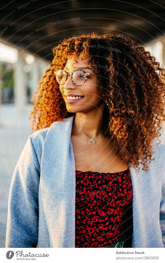 Stylish ethnic female in roofed passage woman street city rest style outfit smile modern young urban trendy black african american curly hair glasses town