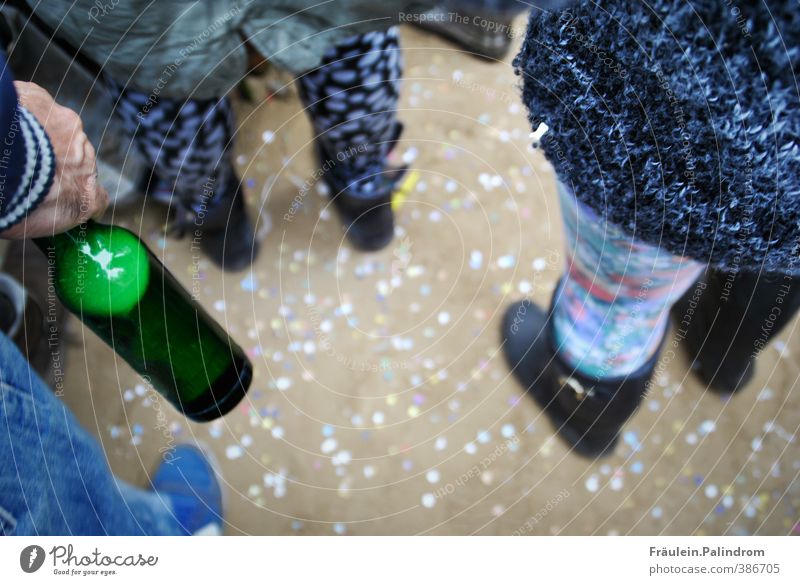 Glass bottle and dancing people stand outside on a floor full of confetti Drinking Cold drink Alcoholic drinks Beer Joy Party Music Bar Cocktail bar Beach bar