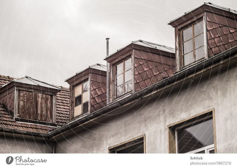 Dormer windows with asbestos fibre cement boards of an old school building Roof Dormers Old dilapidated Wooden window Asbestos fibre cement boards facade panels