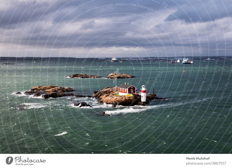 View at the coastline of Gothenburg archipelago baltic bay blue boat buildings cloud clouds cloudy goteborg horizon island landscape lighthouse morning nature