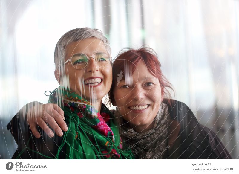 Portrait of two beautiful, laughing women, friends, 50 plus, happy girlfriends Friendship Happiness Together Woman Happy Adults Laughter Exterior shot