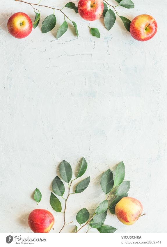 Frame made with apples with green leaves on white background. Top view frame apple tree twigs pattern top view sweet flat table layout freshness ripe group raw