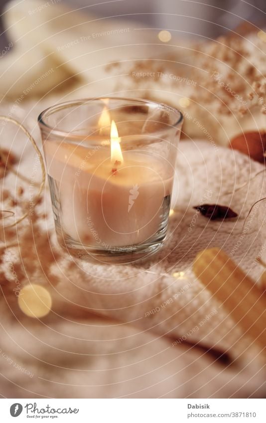 Burning candle and christmas decorations, top view. Winter cozy home and hygge concept background winter fall autumn spa beauty gold flatlay accessories