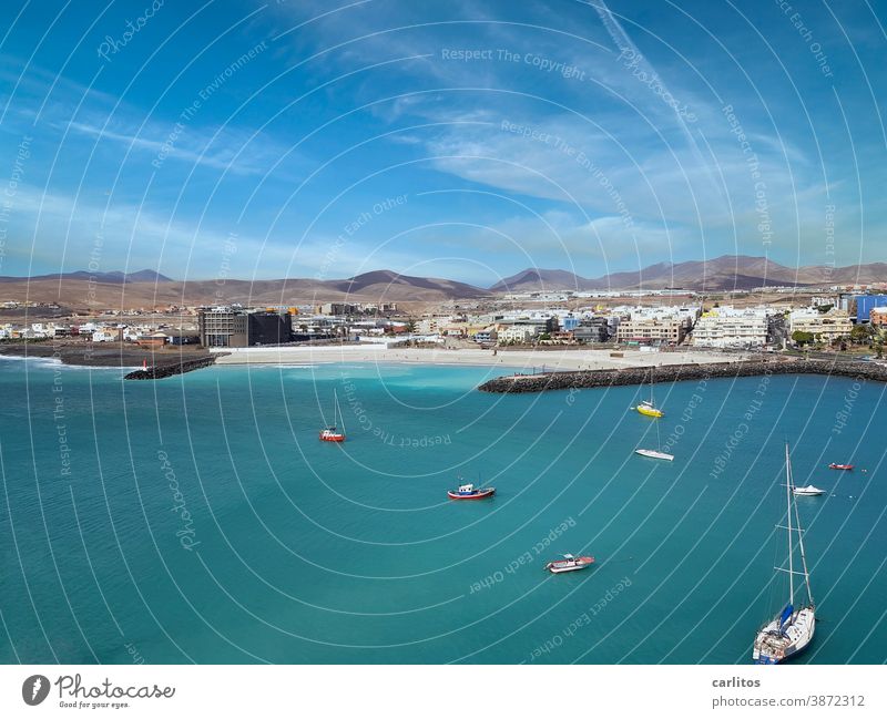 Fuerteventura | Boats in the harbour, no canary(i)birds in sight Canaries Harbour ships boats sailboats Yachts Water Ocean Sky coast Blue Beach