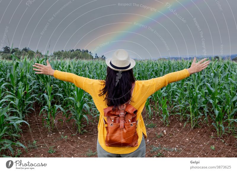 Brunette woman enjoying a walk person walker corn harvest lifestyle hike nature trekking rainbow hiking summer young girl trip beautiful landscape outdoor