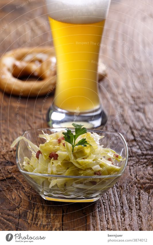 Bavarian coleslaw on dark wood Coleslaw herbaceous Cabbage Wood Beer Pretzel salubriously traditionally Nutrition Food sauerkraut Kitchen white beer Wheat