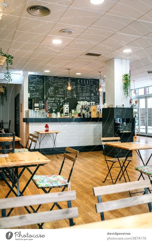 Empty cafe interior with chairs and tables coffee shop cafeteria nobody empty business lockdown coronavirus restaurant lunch furniture dinner light window