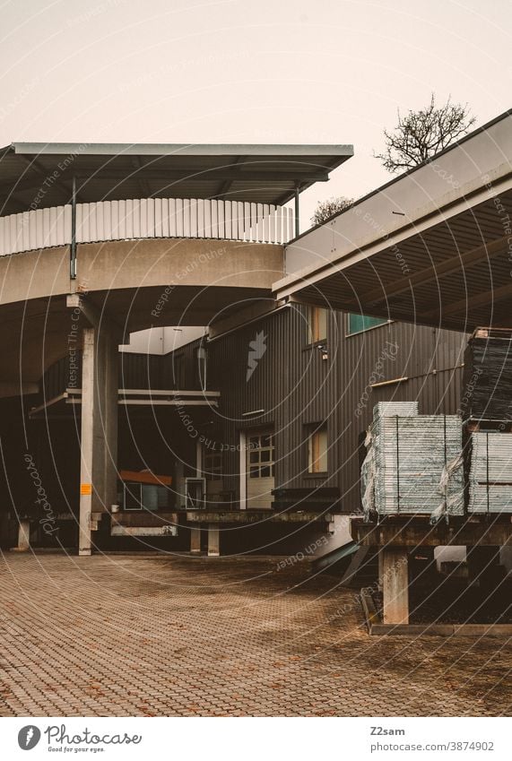 Industrial hall with truck loading ramps Industry Goal Architecture Production Parking Gray White clean lines graphically Building Garage Deserted Transport